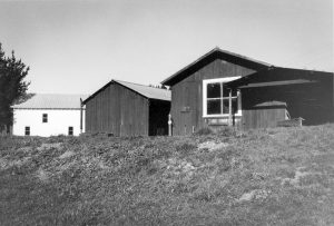 Hagmaier Ranch. Looking up from bottom of small hill to equipment barns and bunk house.
