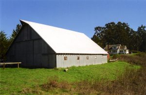 Hagmaier Ranch. Main barn with house in the background. Color image.